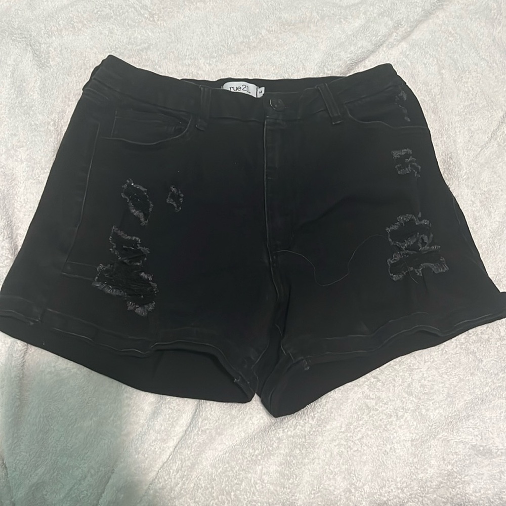 I am selling black ripped jeans shorts,been worn once no stains or anything